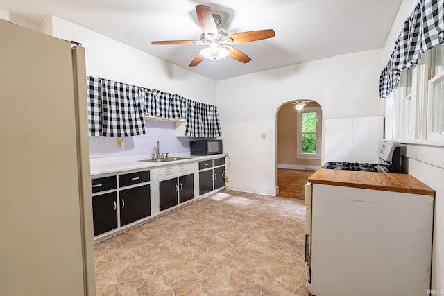 12632 N 325 E, North Manchester, IN 46962 - kitchen featuring black microwave, ceiling fan, arched walkways, dark cabinets, and open shelves