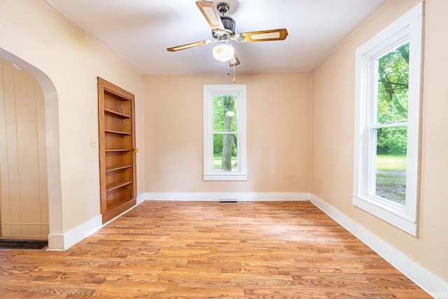 12632 N 325 E, North Manchester, IN 46962 - unfurnished room featuring built in features, healthy amount of natural light, and light wood-type flooring