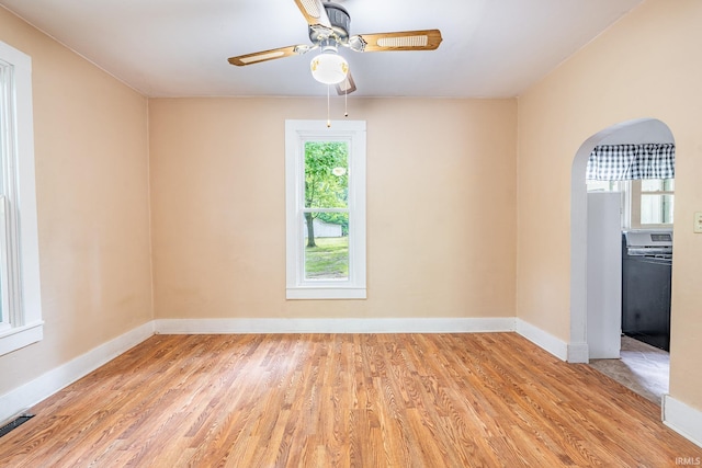 12632 N 325 E, North Manchester, IN 46962 - unfurnished room featuring wood finished floors, arched walkways, and ceiling fan