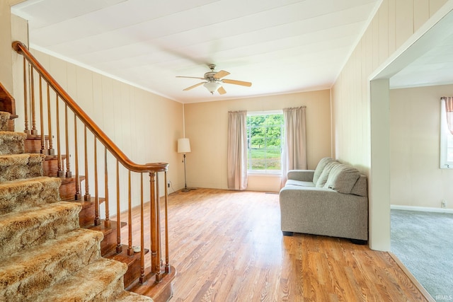 12632 N 325 E, North Manchester, IN 46962 - living room featuring crown molding, wood finished floors, stairs, and ceiling fan