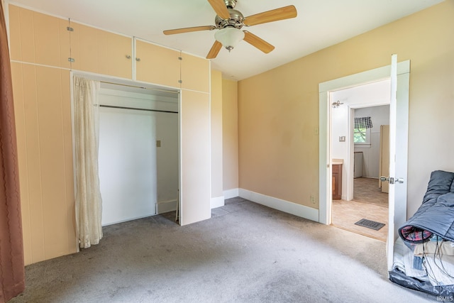 12632 N 325 E, North Manchester, IN 46962 - unfurnished bedroom featuring light carpet, a closet, and ceiling fan