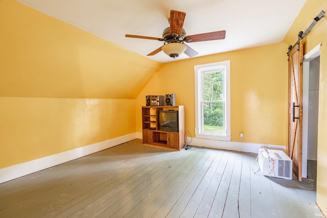 12632 N 325 E, North Manchester, IN 46962 - additional living space with a barn door, wood-type flooring, vaulted ceiling, and a ceiling fan