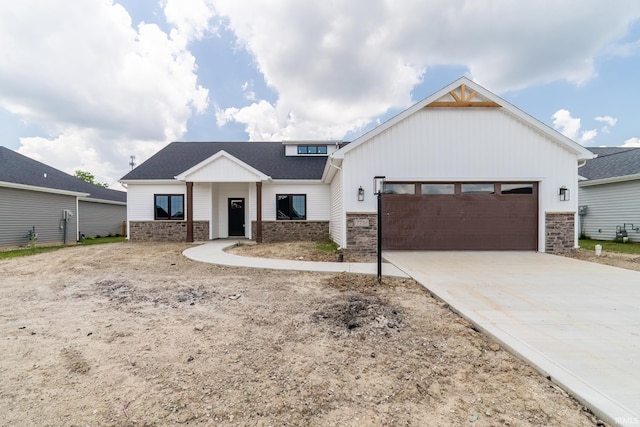 7751 Luna Way, Fort Wayne, IN 46835 - modern inspired farmhouse featuring stone siding, an attached garage, concrete driveway, and board and batten siding