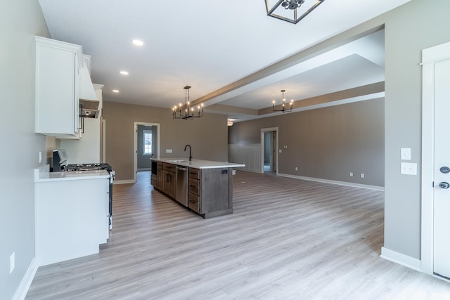 7751 Luna Way, Fort Wayne, IN 46835 - kitchen featuring appliances with stainless steel finishes, a chandelier, white cabinetry, light wood-style floors, and light countertops