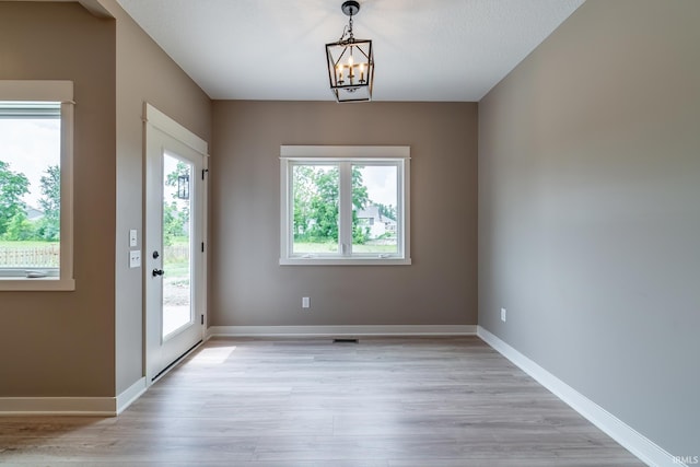 7751 Luna Way, Fort Wayne, IN 46835 - entryway with light wood-style flooring and a chandelier