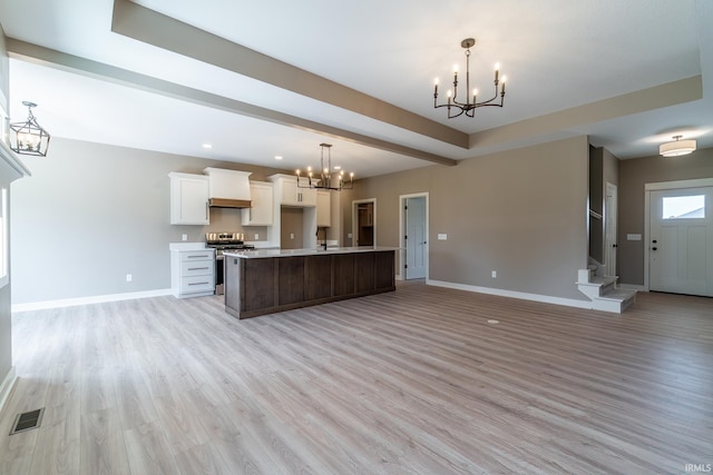 7751 Luna Way, Fort Wayne, IN 46835 - kitchen featuring a chandelier, stainless steel range oven, open floor plan, white cabinetry, and recessed lighting