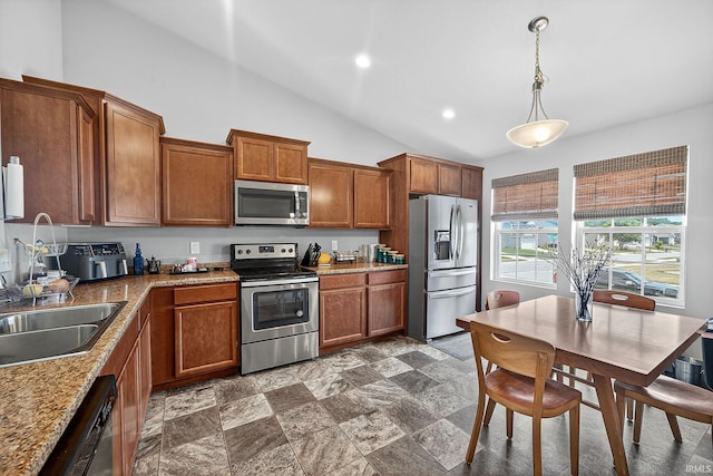4343 Onyx Way S, Bend, IN 46628 - kitchen with stainless steel appliances, lofted ceiling, brown cabinets, decorative light fixtures, and recessed lighting
