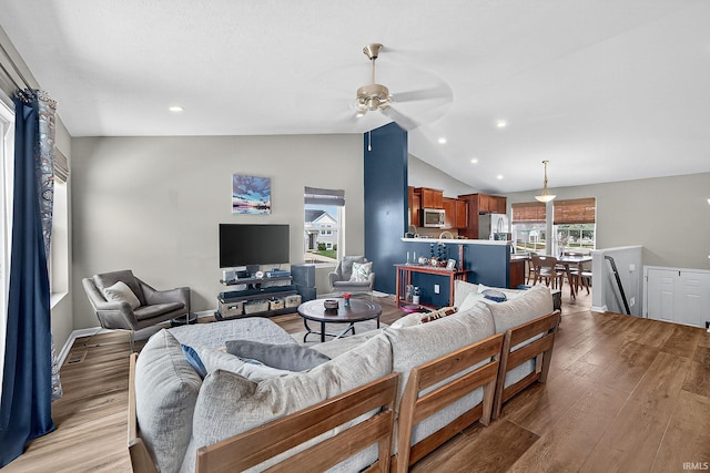 4343 Onyx Way S, Bend, IN 46628 - living area featuring lofted ceiling, light wood-style flooring, a ceiling fan, and recessed lighting