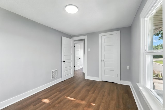 2020 Electric Ave, Fort Wayne, IN 46802 - unfurnished bedroom featuring baseboards and dark wood finished floors