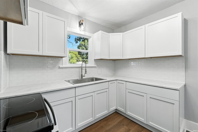 2020 Electric Ave, Fort Wayne, IN 46802 - kitchen with black / electric stove, a textured ceiling, dark wood finished floors, backsplash, and white cabinetry