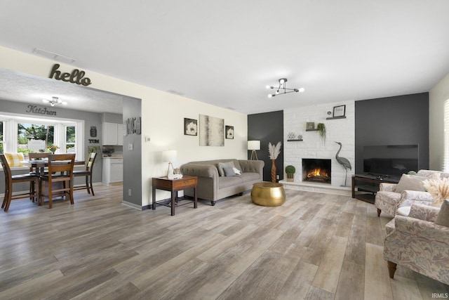 4831 Woodford Dr, Fort Wayne, IN 46835 - living area featuring light wood-style floors and a fireplace