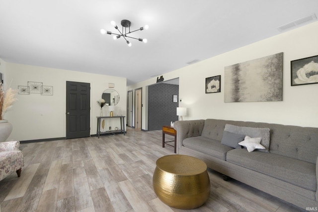 4831 Woodford Dr, Fort Wayne, IN 46835 - living room featuring light wood-style flooring and a chandelier