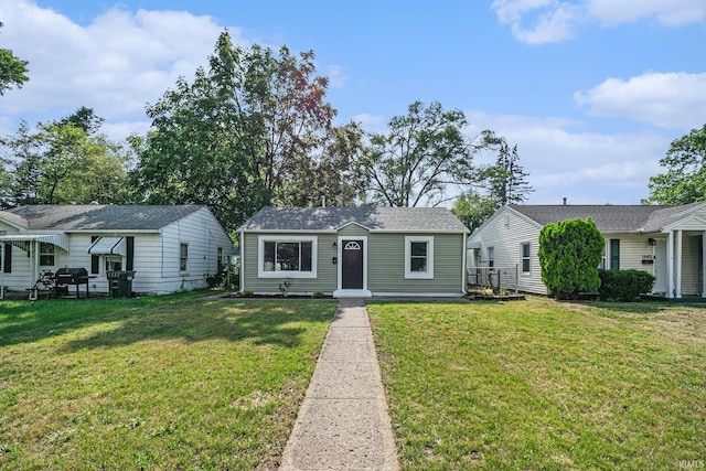 1641 N Adams St, South Bend, IN 46628 - bungalow-style home with a front yard and an outbuilding