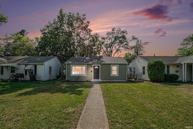 1641 N Adams St, South Bend, IN 46628 - view of front facade featuring a lawn and an outdoor structure