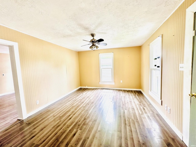 120 W Warren St, Mitchell, IN 47446 - unfurnished room with a textured ceiling, wood finished floors, and ceiling fan
