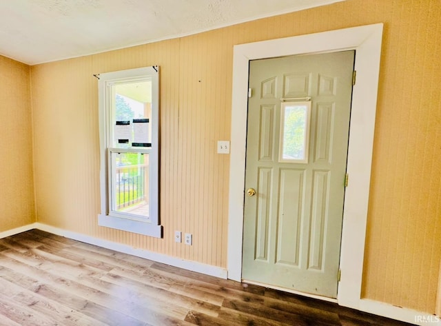 120 W Warren St, Mitchell, IN 47446 - foyer entrance featuring wood finished floors and crown molding