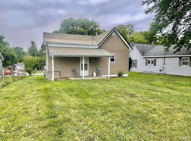 120 W Warren St, Mitchell, IN 47446 - back of property with a metal roof and a patio
