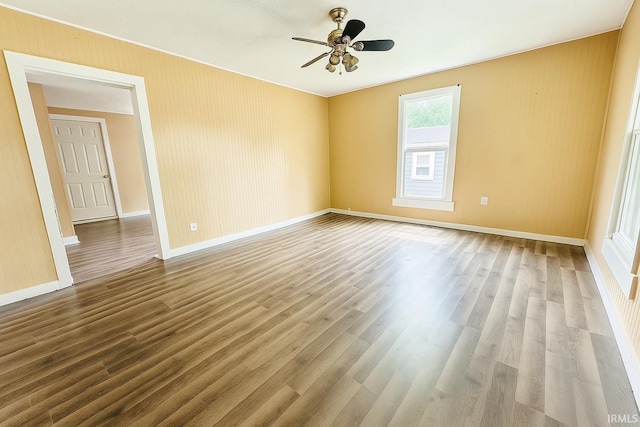 120 W Warren St, Mitchell, IN 47446 - spare room with wood finished floors and ceiling fan