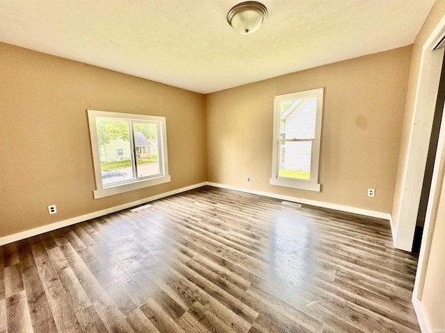 120 W Warren St, Mitchell, IN 47446 - empty room featuring wood finished floors and baseboards
