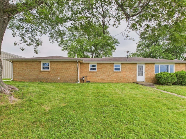 203 E Plum St, Frankton, IN 46044 - back of property featuring brick siding and a lawn