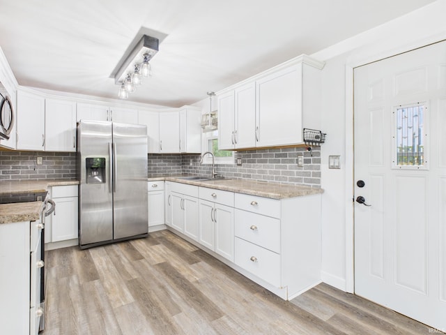 203 E Plum St, Frankton, IN 46044 - kitchen featuring stainless steel refrigerator with ice dispenser, white electric range oven, decorative backsplash, and light wood-type flooring