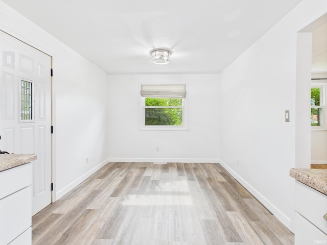 203 E Plum St, Frankton, IN 46044 - unfurnished dining area with plenty of natural light and light wood finished floors