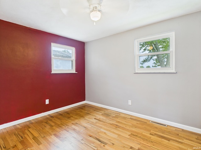 203 E Plum St, Frankton, IN 46044 - spare room featuring plenty of natural light, ceiling fan, and light wood-type flooring