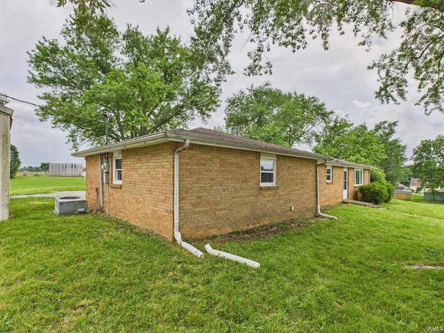 203 E Plum St, Frankton, IN 46044 - view of home's exterior featuring a yard and brick siding
