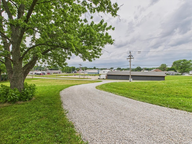 203 E Plum St, Frankton, IN 46044 - view of community with a yard and driveway