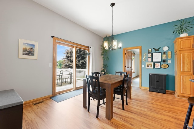 16619 Amethyst Pkwy, Fort Wayne, IN 46845 - dining room with light wood finished floors and a chandelier
