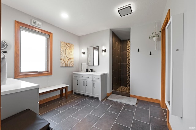 16619 Amethyst Pkwy, Fort Wayne, IN 46845 - bathroom with vanity, a tile shower, tile patterned floors, and recessed lighting