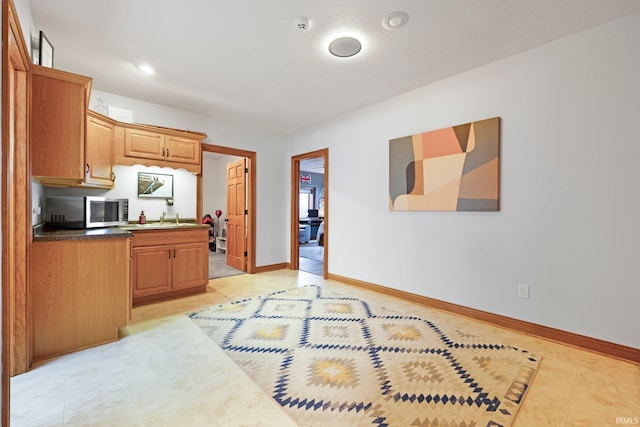 16619 Amethyst Pkwy, Fort Wayne, IN 46845 - kitchen with stainless steel microwave and dark countertops