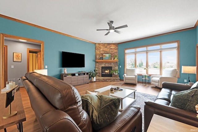 16619 Amethyst Pkwy, Fort Wayne, IN 46845 - living room with crown molding, a ceiling fan, wood finished floors, and a fireplace