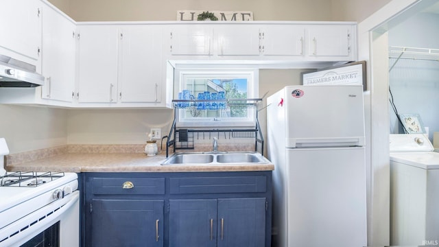 1607 Franklin Ave, Fort Wayne, IN 46808 - kitchen with white appliances, washer / clothes dryer, white cabinets, light countertops, and ventilation hood