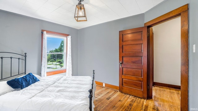 1607 Franklin Ave, Fort Wayne, IN 46808 - bedroom with baseboards and hardwood / wood-style floors