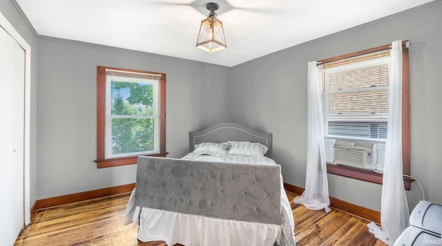 1607 Franklin Ave, Fort Wayne, IN 46808 - bedroom with wood finished floors, cooling unit, and ornamental molding