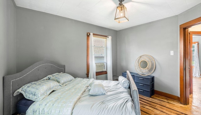 1607 Franklin Ave, Fort Wayne, IN 46808 - bedroom featuring wood finished floors, crown molding, and cooling unit