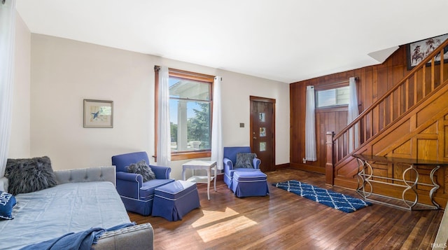 1607 Franklin Ave, Fort Wayne, IN 46808 - living room featuring stairway, wood finished floors, and wood walls