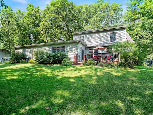 8220 Sakaden Pkwy, Fort Wayne, IN 46825 - back of house featuring a deck, a lawn, and a chimney
