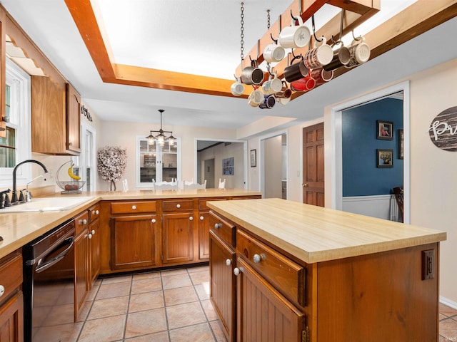 8220 Sakaden Pkwy, Fort Wayne, IN 46825 - kitchen featuring stainless steel dishwasher, butcher block counters, a chandelier, a peninsula, and brown cabinets