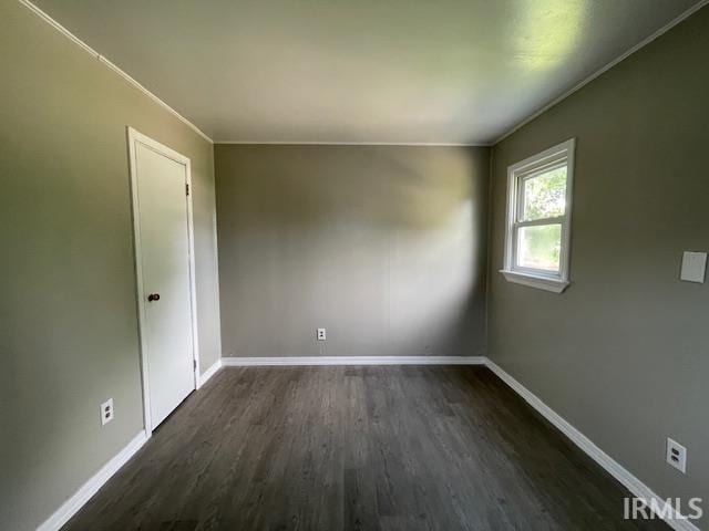 106 N Wellington St, South Bend, IN 46619 - spare room with dark wood-style flooring and baseboards