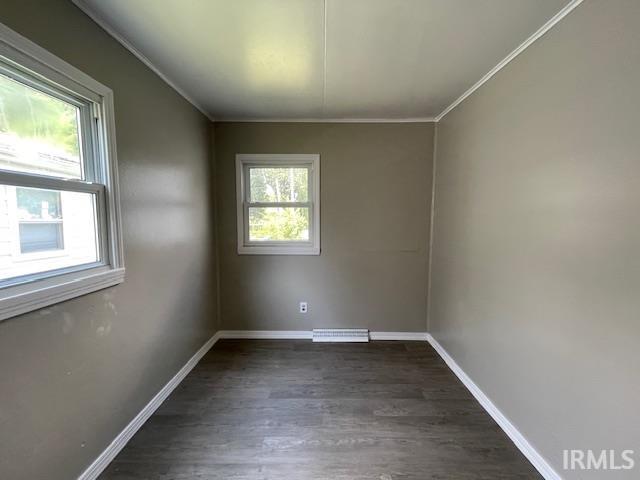 106 N Wellington St, South Bend, IN 46619 - empty room with crown molding and dark wood-style flooring