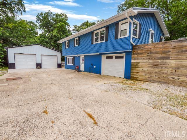 7132 W 350 N, West Lafayette, IN 47906 - view of side of home featuring a detached garage and an outbuilding