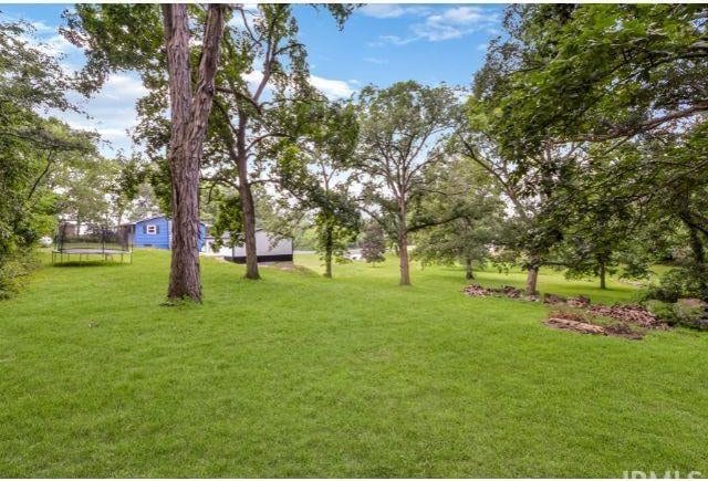7132 W 350 N, West Lafayette, IN 47906 - view of grassy yard with a trampoline
