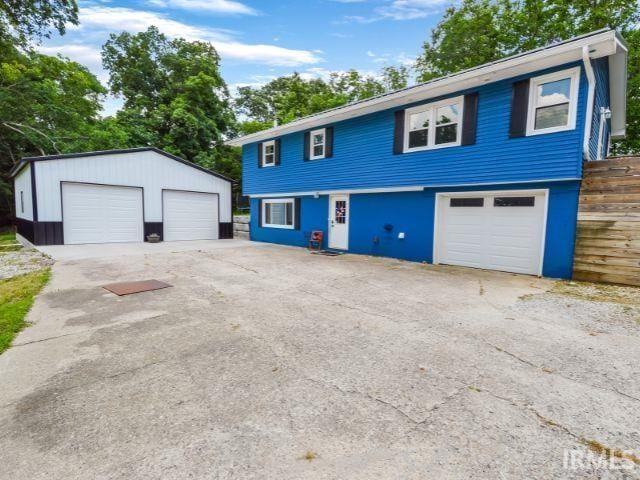 7132 W 350 N, West Lafayette, IN 47906 - view of front facade with a garage and an outdoor structure