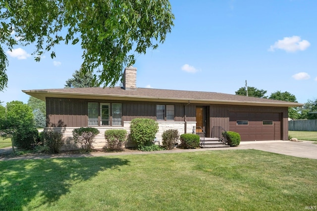 1202 Park Ave, New Haven, IN 46774 - ranch-style house with concrete driveway, a chimney, an attached garage, and a front yard