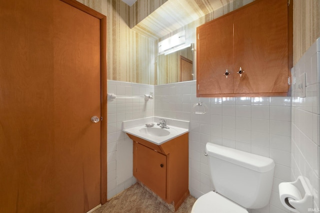 1202 Park Ave, New Haven, IN 46774 - bathroom with vanity, wallpapered walls, and tile walls