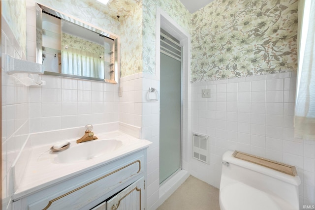 1202 Park Ave, New Haven, IN 46774 - bathroom featuring tile walls, wallpapered walls, vanity, a wainscoted wall, and a shower stall