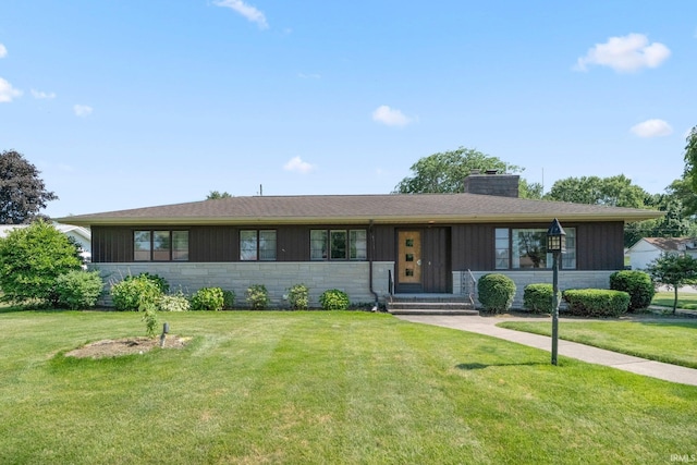 1202 Park Ave, New Haven, IN 46774 - ranch-style house with entry steps, stone siding, a front lawn, and a chimney