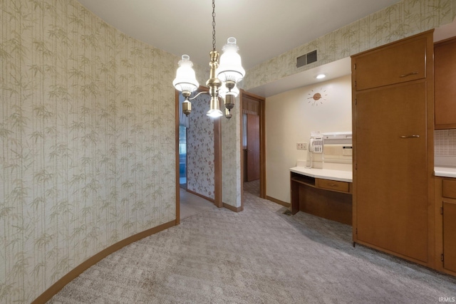 1202 Park Ave, New Haven, IN 46774 - dining area with wallpapered walls, a chandelier, and light colored carpet